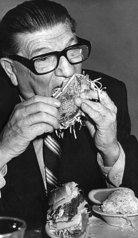 Howard Jarvis eating a sandwich